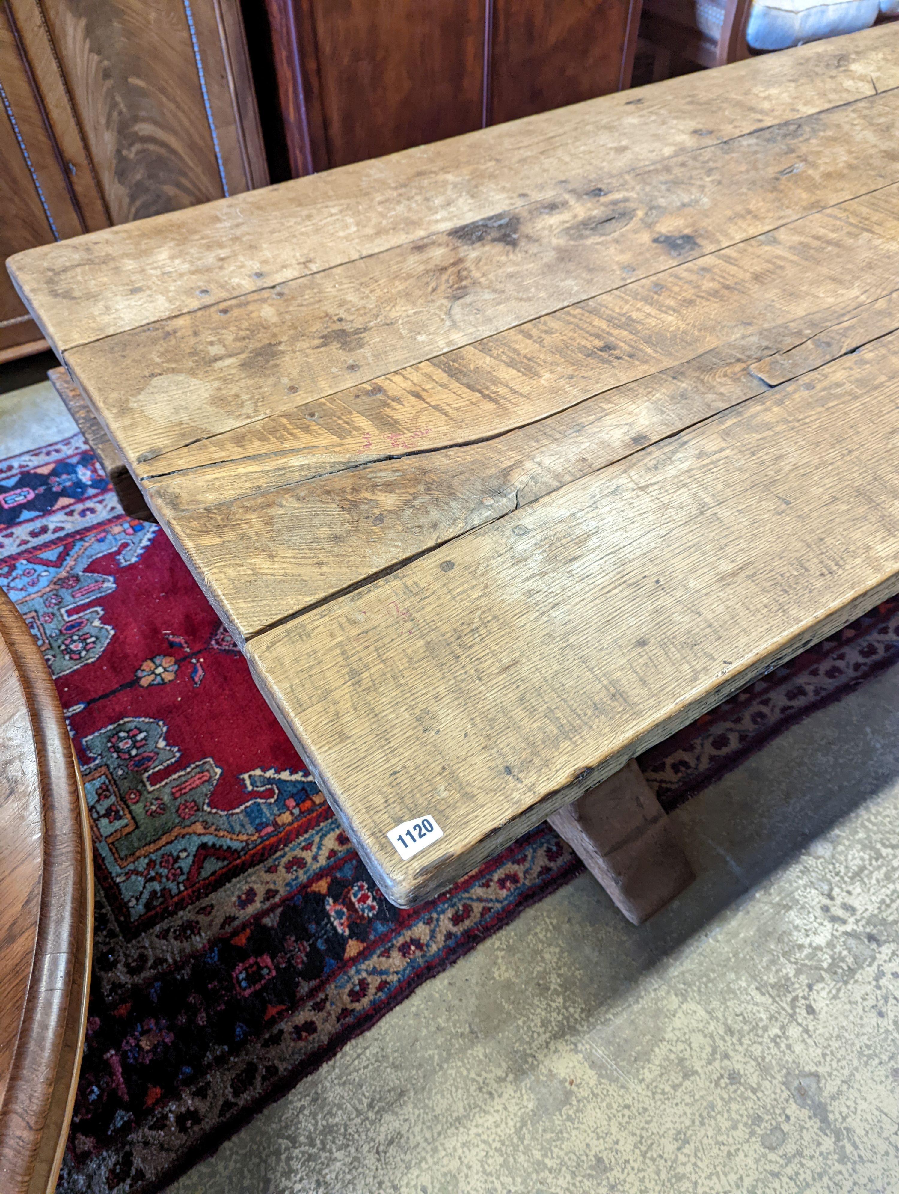 An 18th century style oak refectory dining table with planked top, length 228cm, depth 96cm, height 74cm